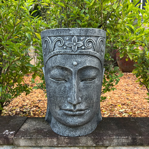 Resin Budha head pot.